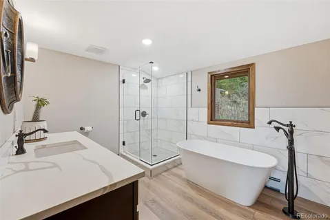 a bathroom with a bathtub and a sink