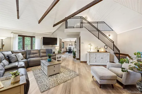 a living room with furniture or couch and a wooden floor