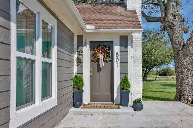 a view of a house with a small garden