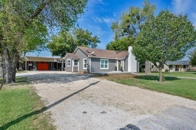 front view of house with a yard
