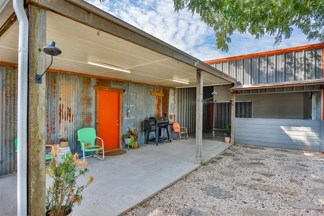 a view of a porch with seating space