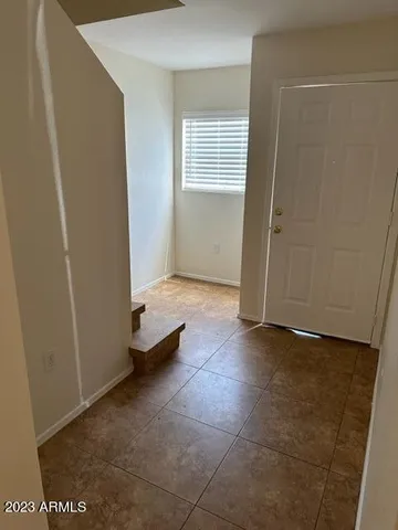 a view of an empty room with windows