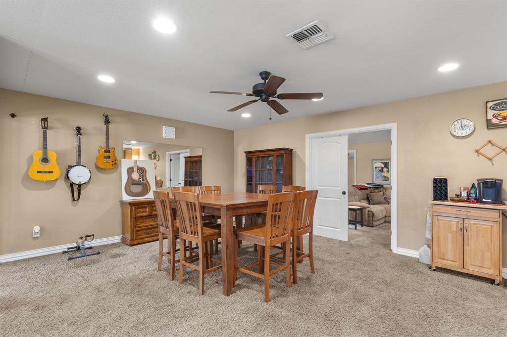 4504 Jennings Avenue Wichita Falls, TX 76310 - Photo 11 of 26 a view of a dining room with furniture and a chandelier