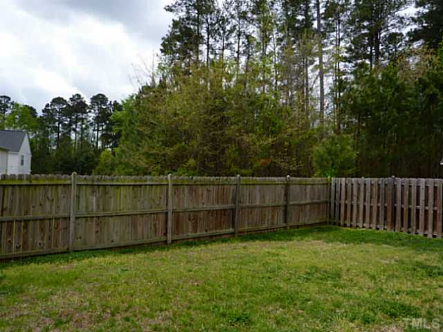 3152 La Costa Way Raleigh, NC 27610 - Photo 23 of 25 a view of a yard with wooden fence
