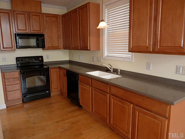 3152 La Costa Way Raleigh, NC 27610 - Photo 4 of 25 a kitchen with granite countertop cabinets stainless steel appliances and a sink