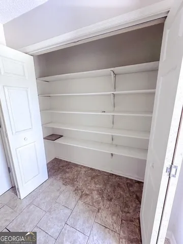 a bathroom with sink toilet and window