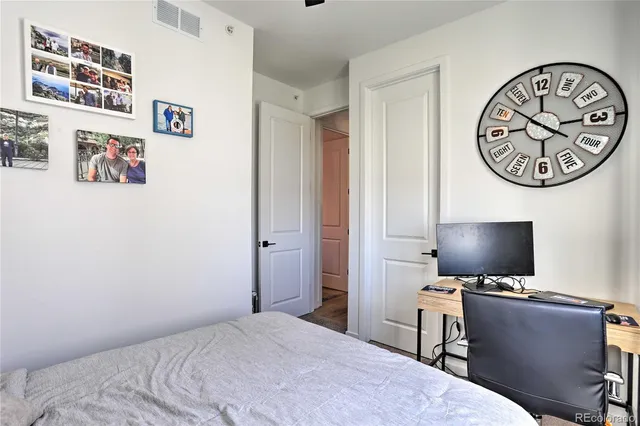 a bedroom with a workspace