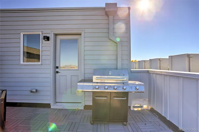 a view of a balcony with furniture