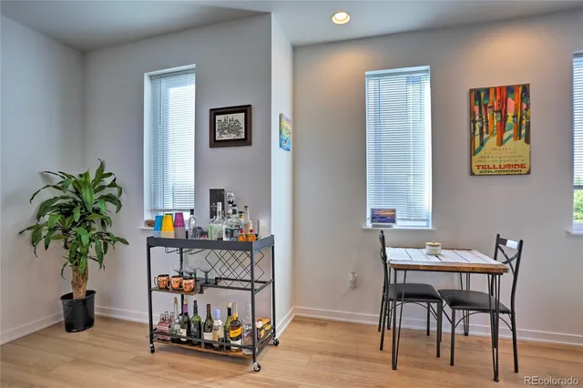 a view of a workspace with furniture and a potted plant