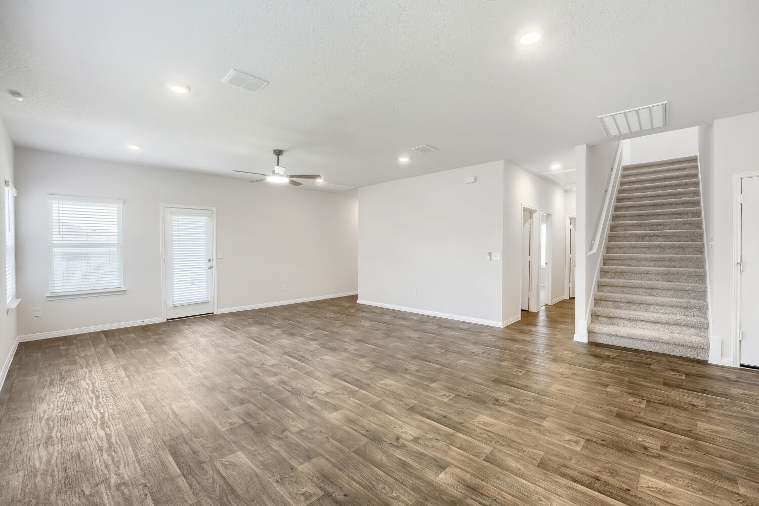 13507 Howser Trace Manor, TX 78653 - Photo 27 of 28 An open floorplan with durable flooring creates a versatile living area and inviting atmosphere.
