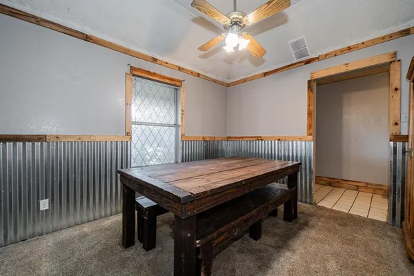 a bed room with a bed and a chandelier