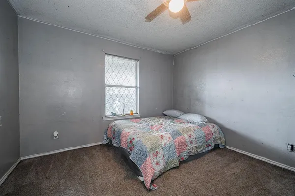 a bathroom with a sink a toilet a mirror and shower