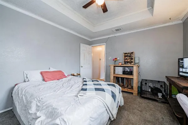 a view of a backyard with wooden fence