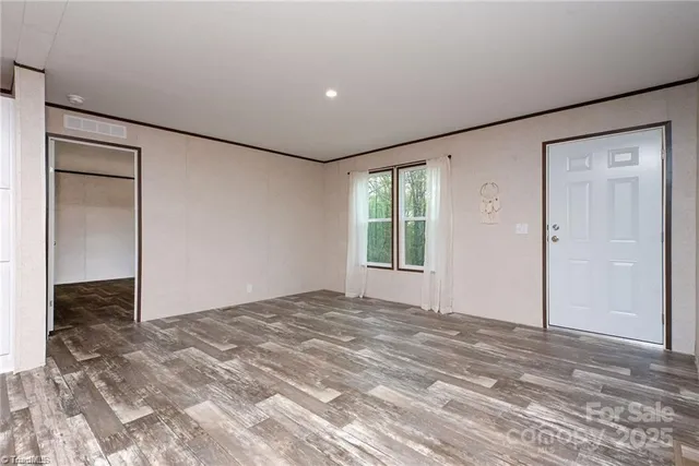 a view of an empty room and window