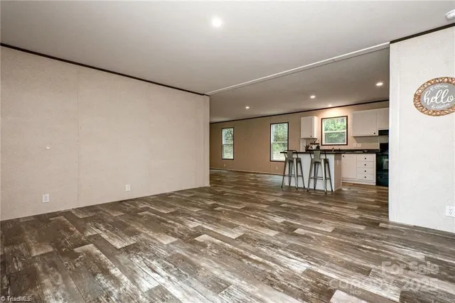 a view of kitchen with furniture and wooden floor