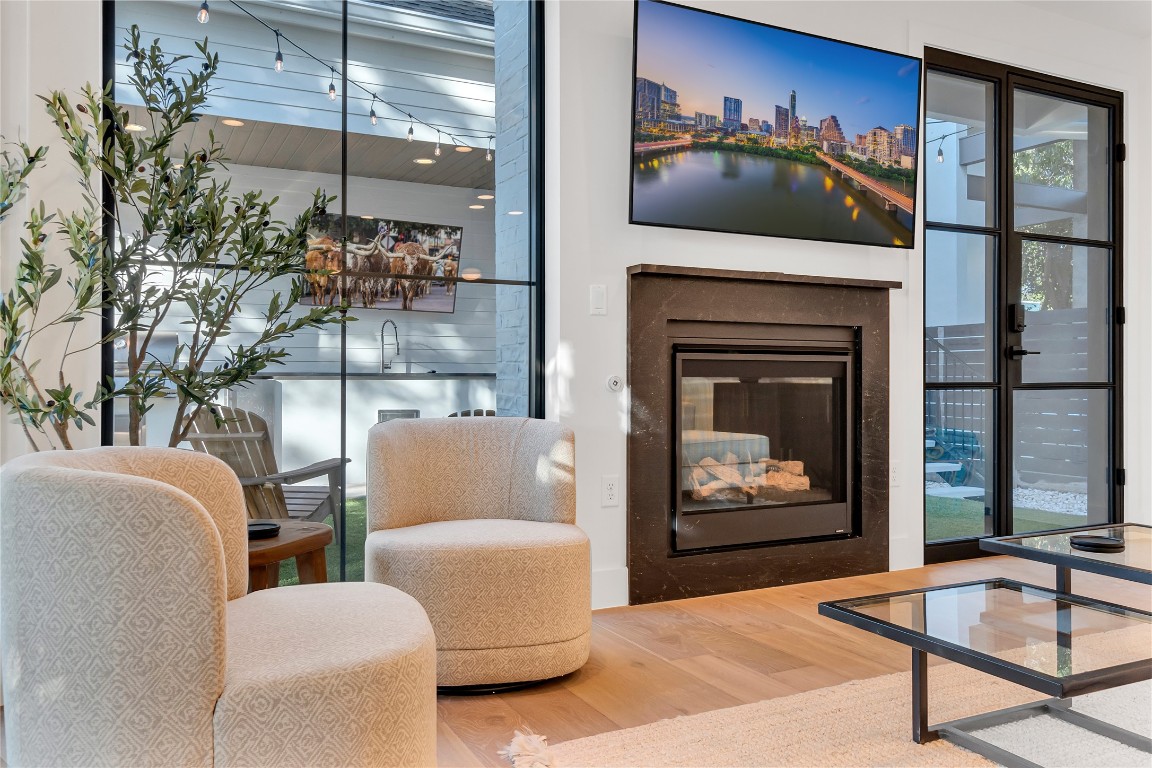 1902 Tillotson Avenue Austin, TX 78702 - Photo 13 of 40 a living room with furniture and a fireplace