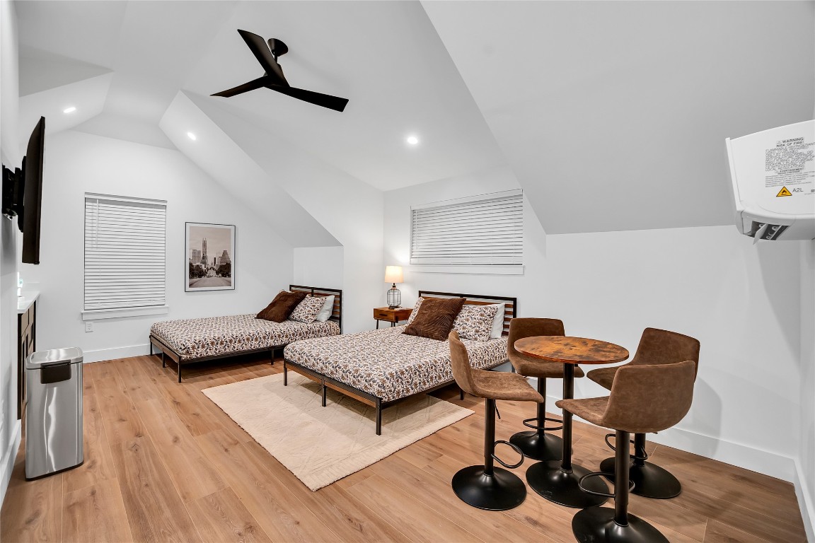 1902 Tillotson Avenue Austin, TX 78702 - Photo 32 of 40 Bedroom with light wood finished floors, recessed lighting, ceiling fan, and lofted ceiling