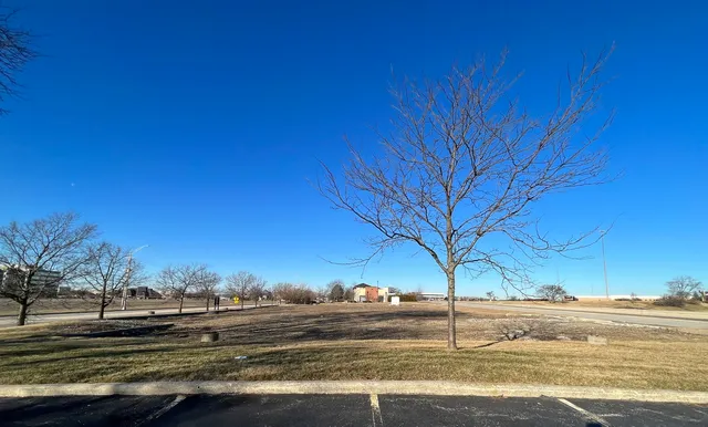 a view of a road with a building in the background