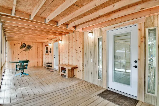 a balcony with table and chairs