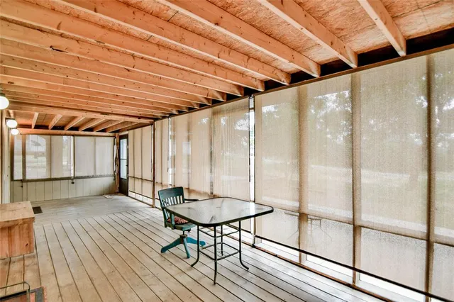 a view of a balcony with wooden floor