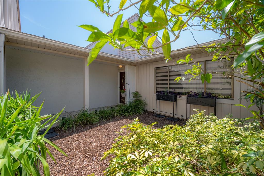 a house view with a garden space