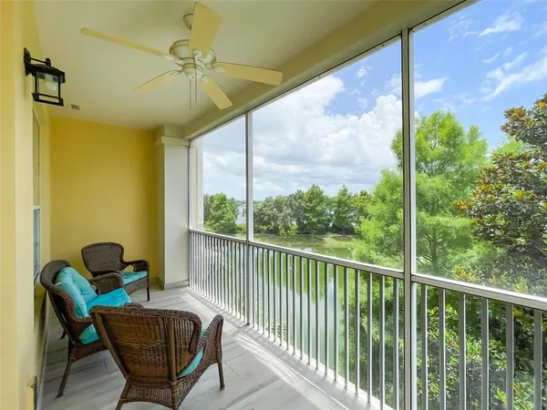 a view of a balcony with furniture