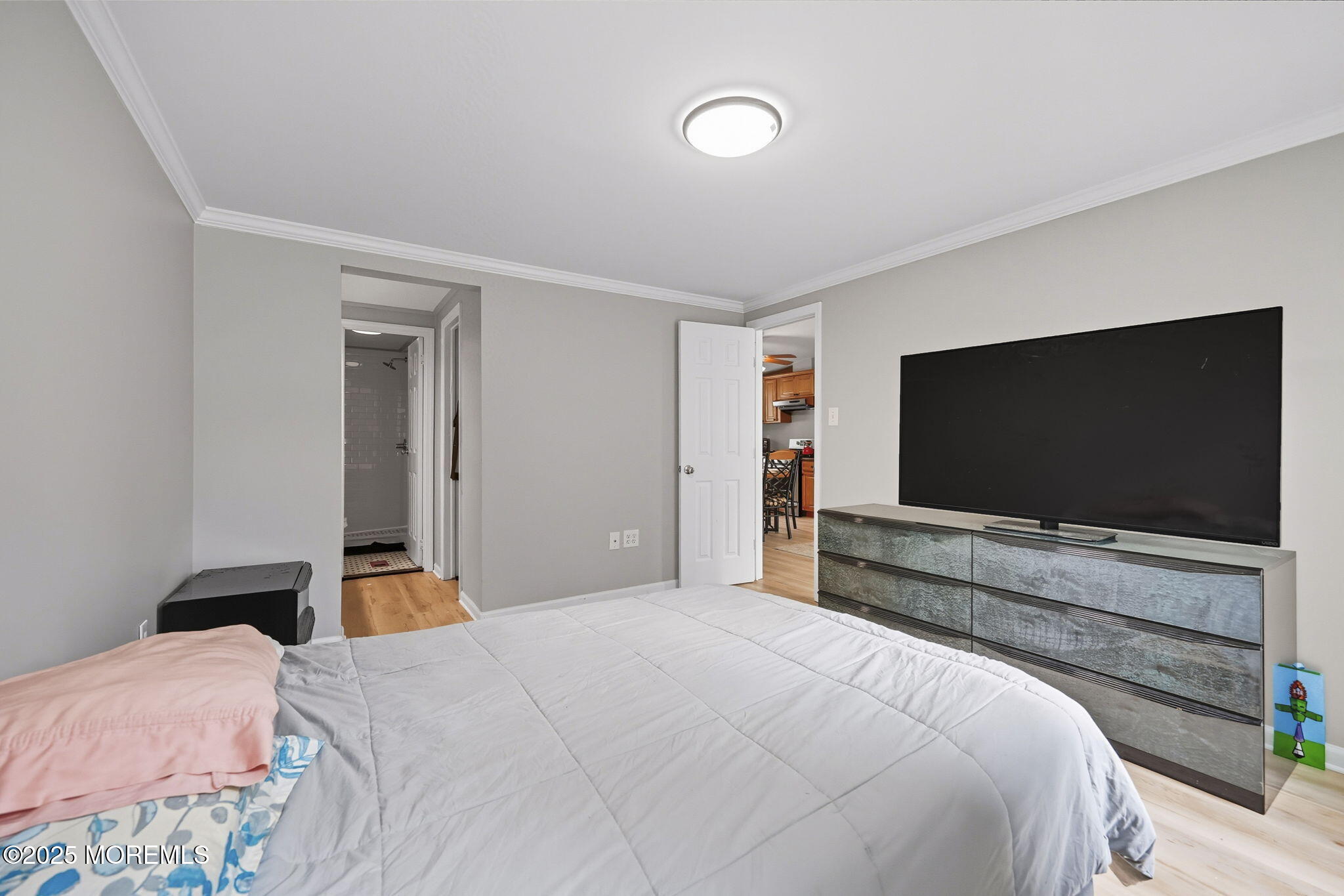 12 Alydar Court Howell, NJ 07731 - Photo 11 of 24 a bedroom with a bed and a flat screen tv