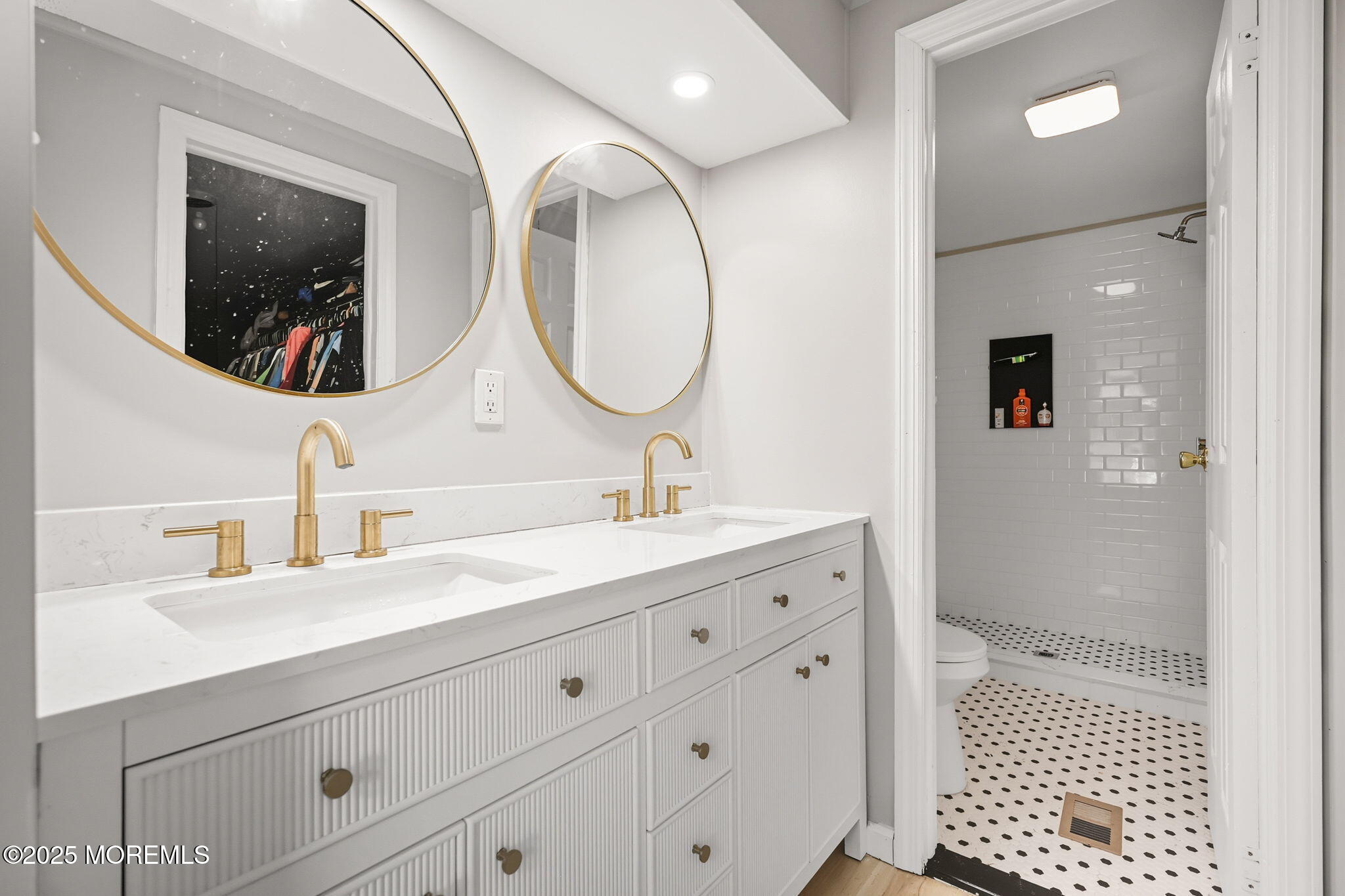 12 Alydar Court Howell, NJ 07731 - Photo 12 of 24 a bathroom with a double vanity sink mirror and shower