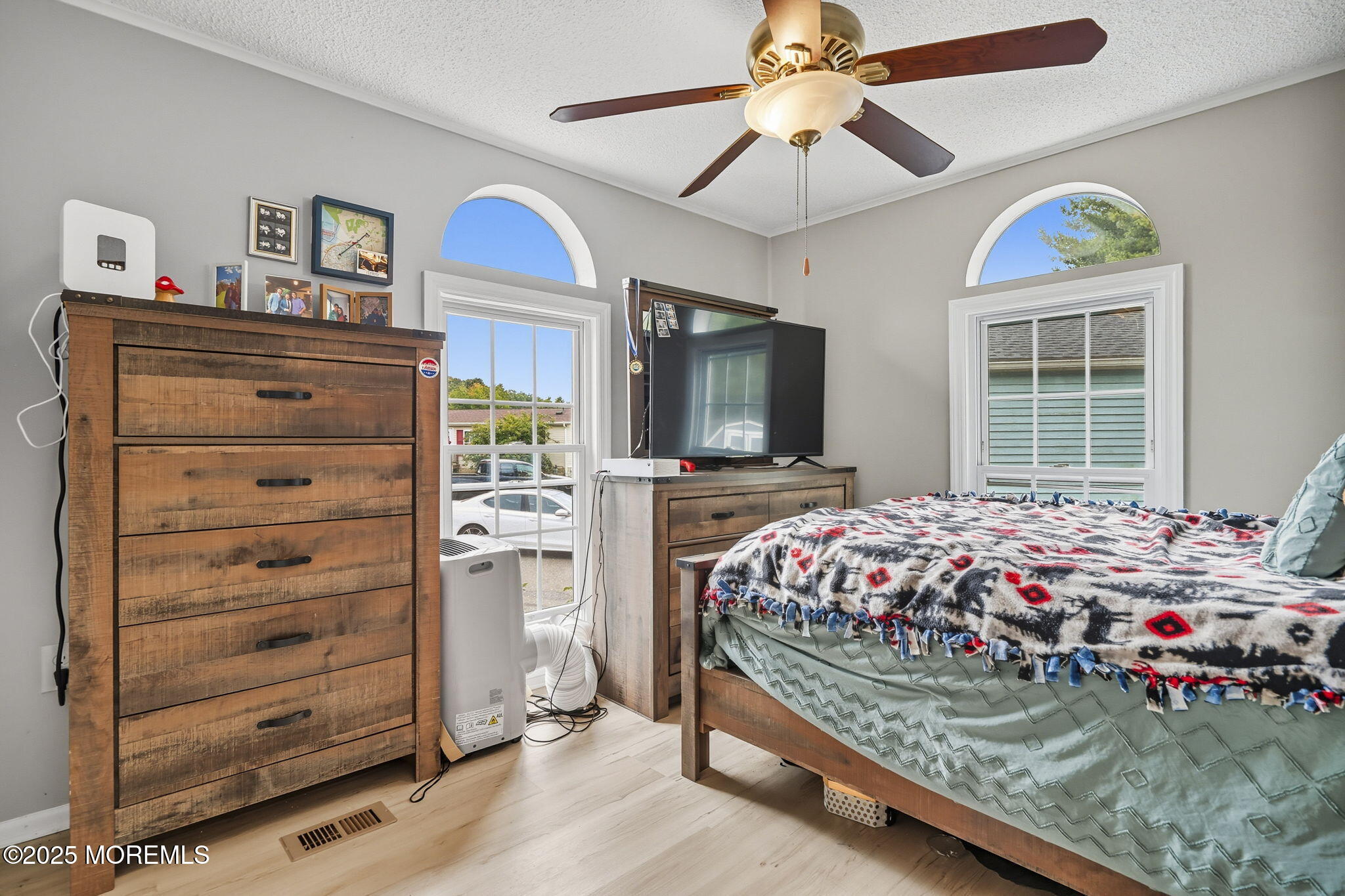 12 Alydar Court Howell, NJ 07731 - Photo 14 of 24 a bedroom with a bed a dresser and flat screen tv