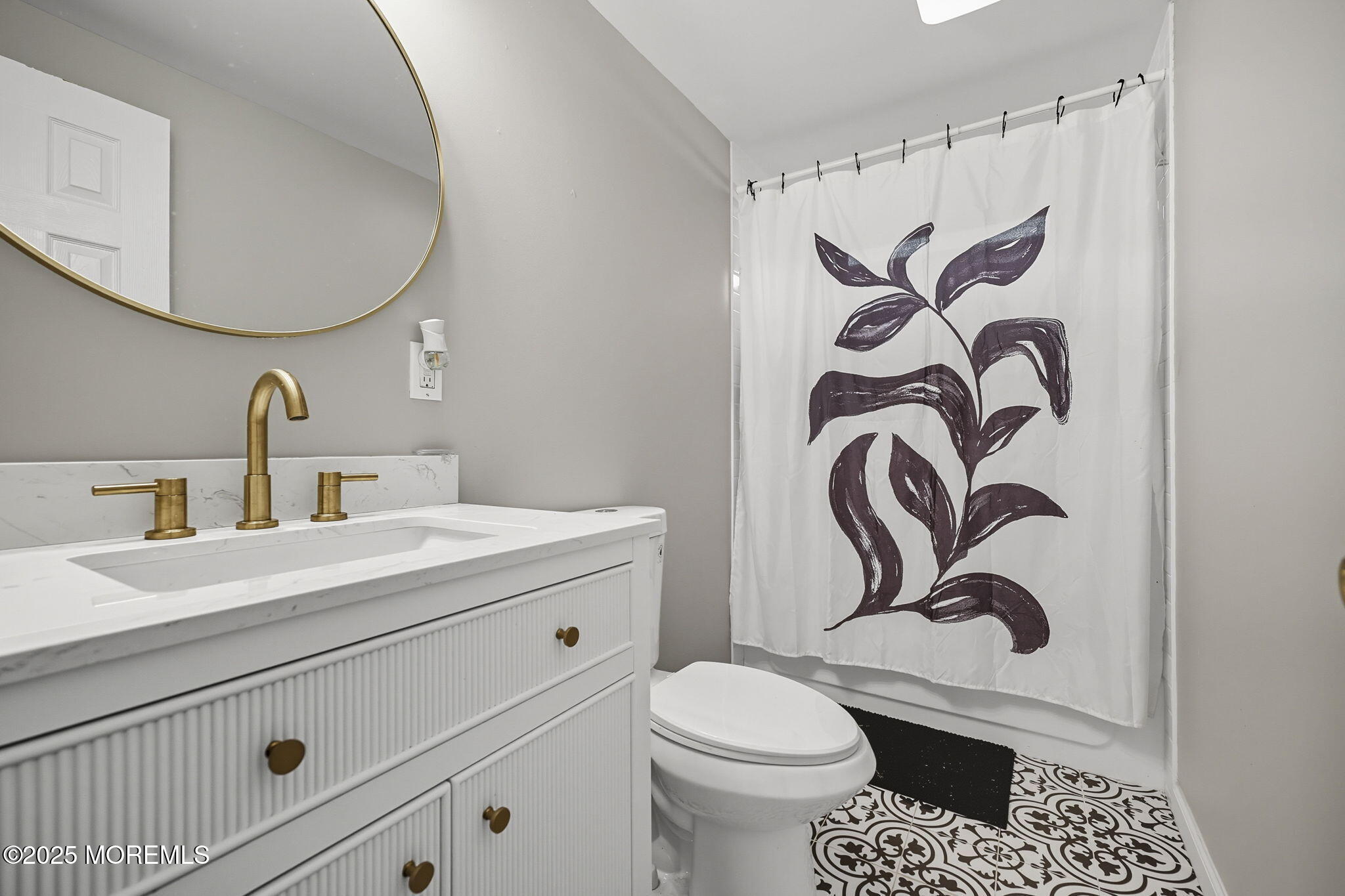 12 Alydar Court Howell, NJ 07731 - Photo 15 of 24 a bathroom with a toilet sink and mirror