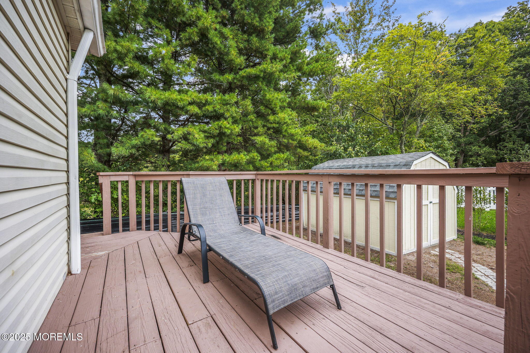 12 Alydar Court Howell, NJ 07731 - Photo 22 of 24 a balcony with wooden floor and fence