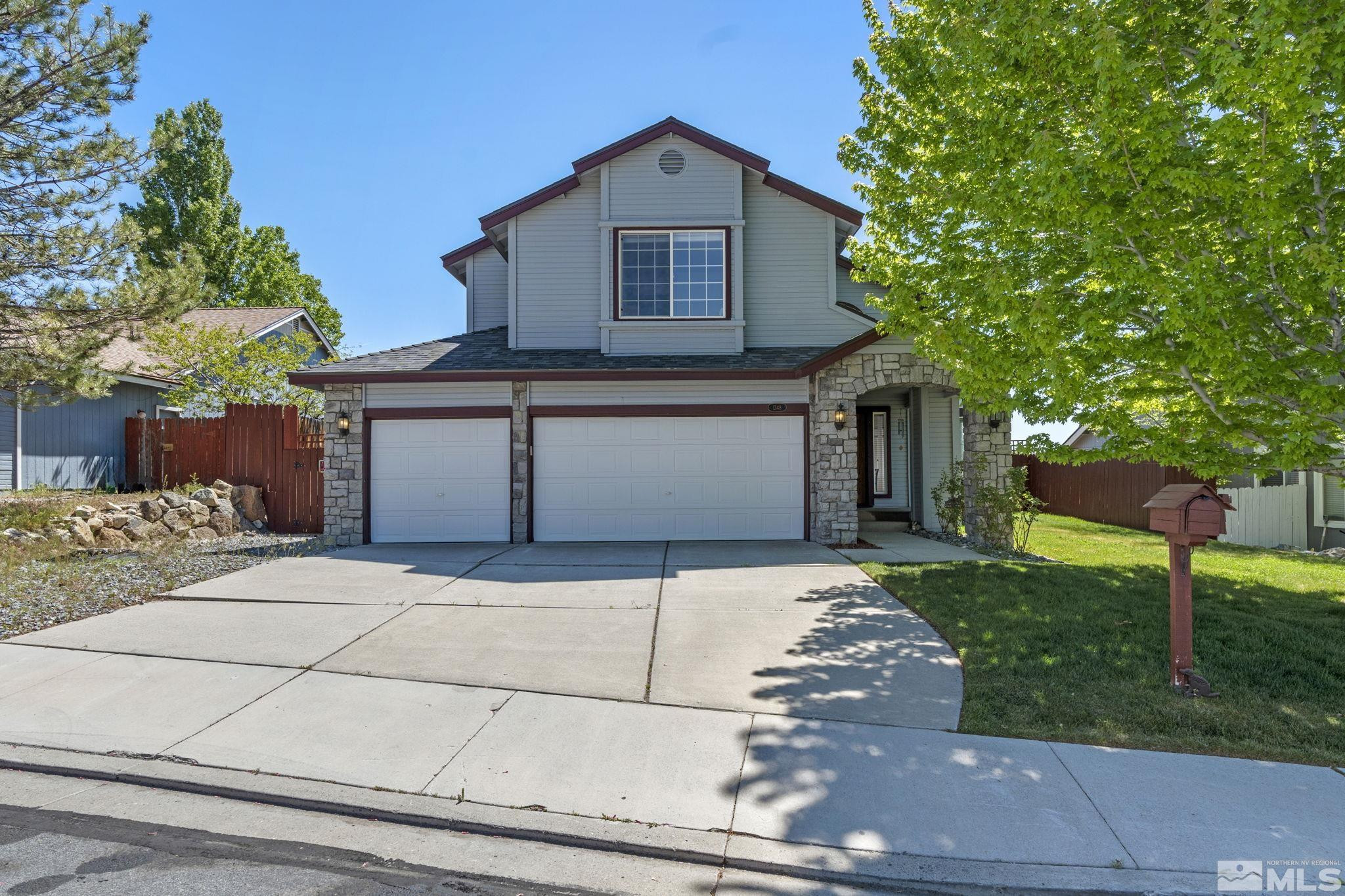 1348 Backer Way Reno, NV 89523 - Photo 1 of 40 a front view of a house with a garden