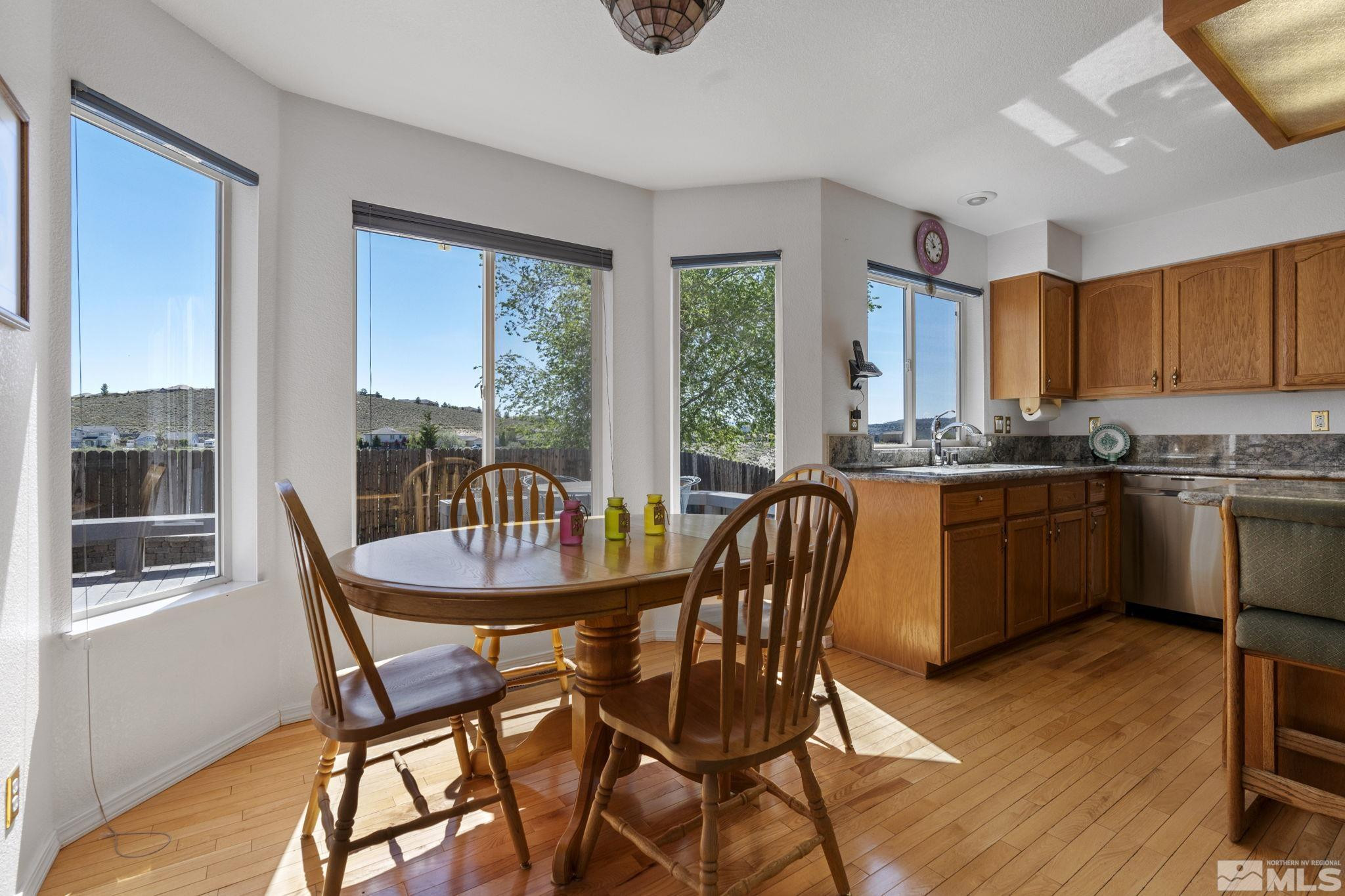 1348 Backer Way Reno, NV 89523 - Photo 19 of 40 a view of a dining room with furniture window and wooden floor