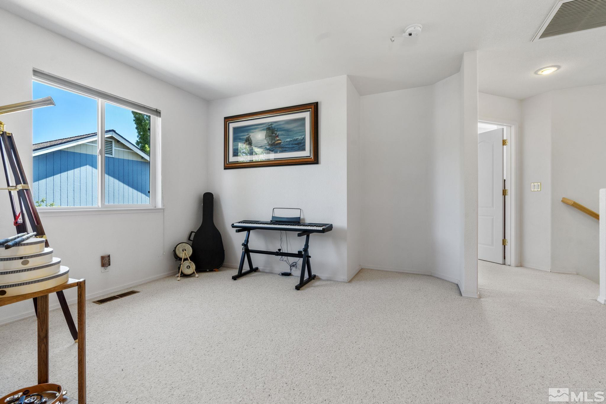 1348 Backer Way Reno, NV 89523 - Photo 20 of 40 a room with furniture and window