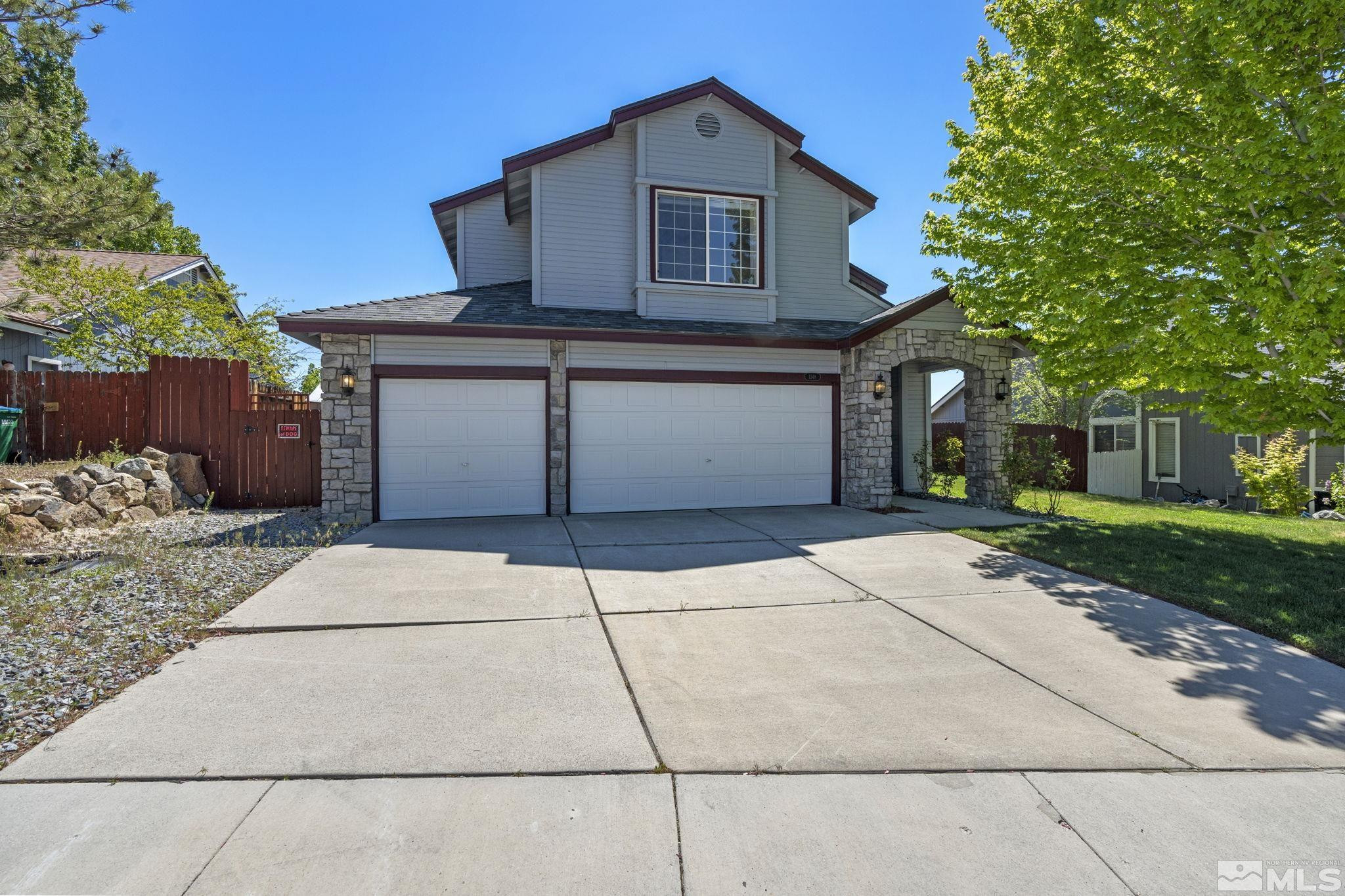 1348 Backer Way Reno, NV 89523 - Photo 2 of 40 a front view of a house with a garden