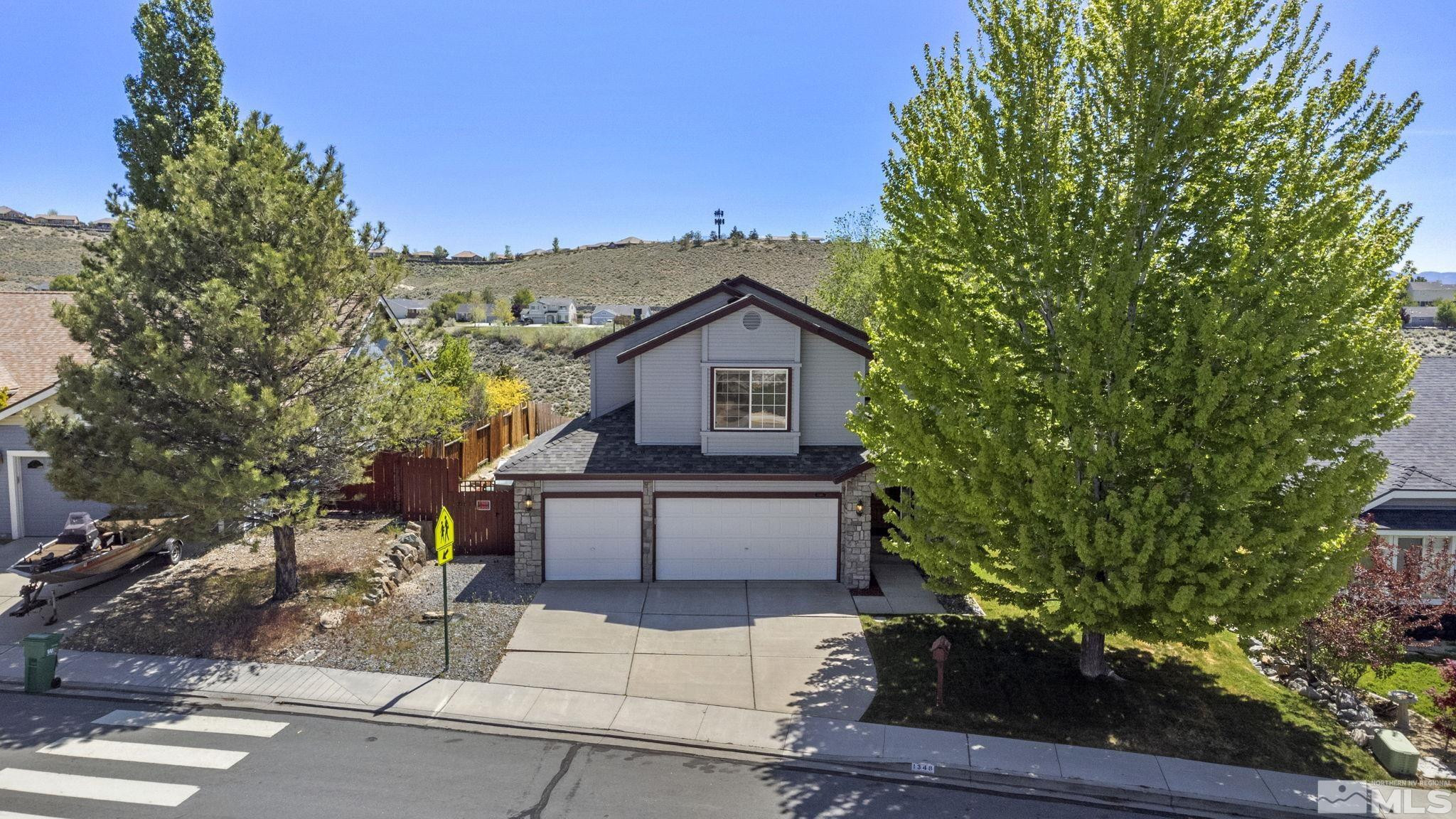 1348 Backer Way Reno, NV 89523 - Photo 3 of 40 a view of house with a yard and potted plants