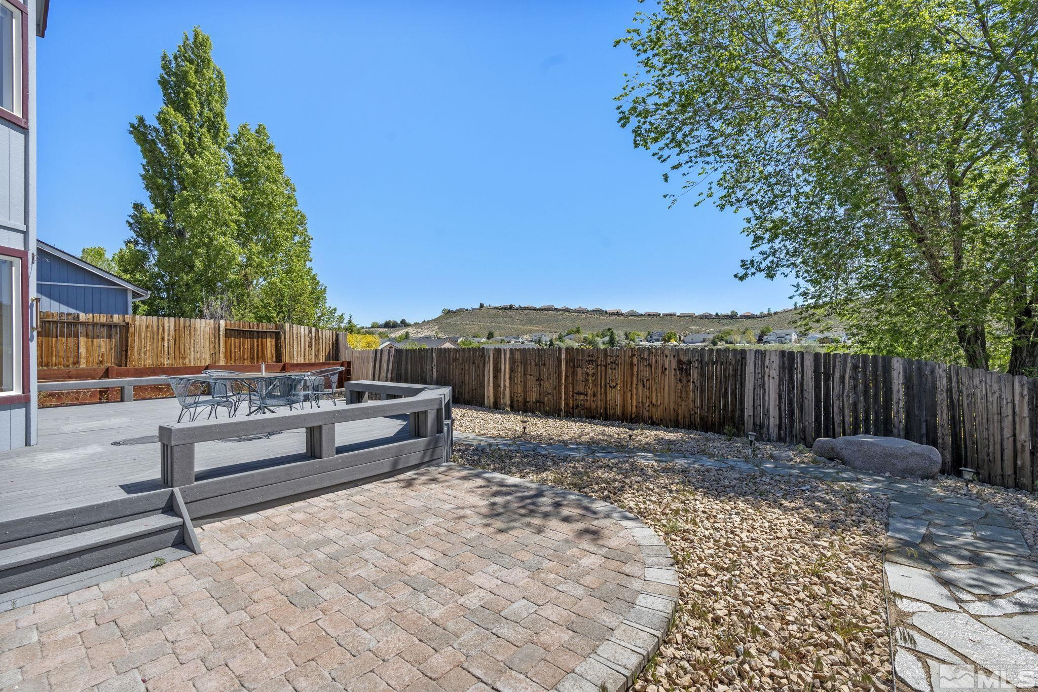 1348 Backer Way Reno, NV 89523 - Photo 33 of 40 a view of a backyard with a bench