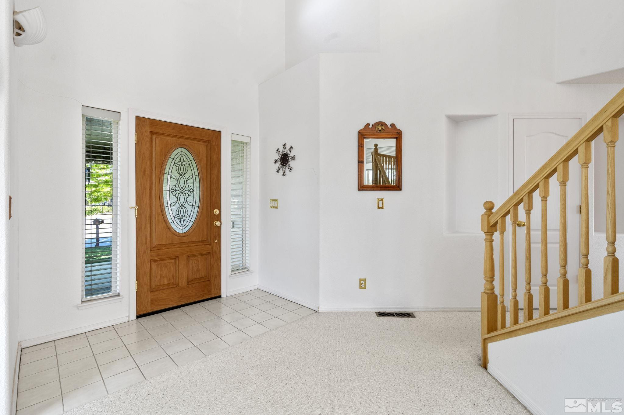 1348 Backer Way Reno, NV 89523 - Photo 4 of 40 a view of hallway with stairs and wooden floor