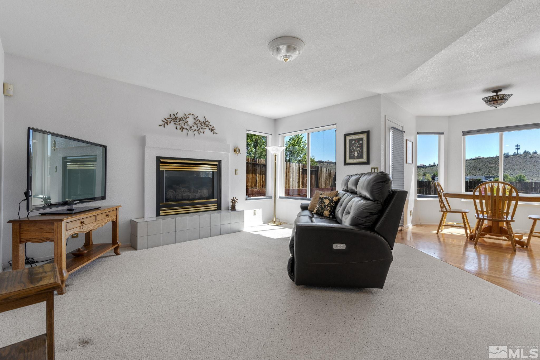 1348 Backer Way Reno, NV 89523 - Photo 9 of 40 a living room with furniture and a flat screen tv