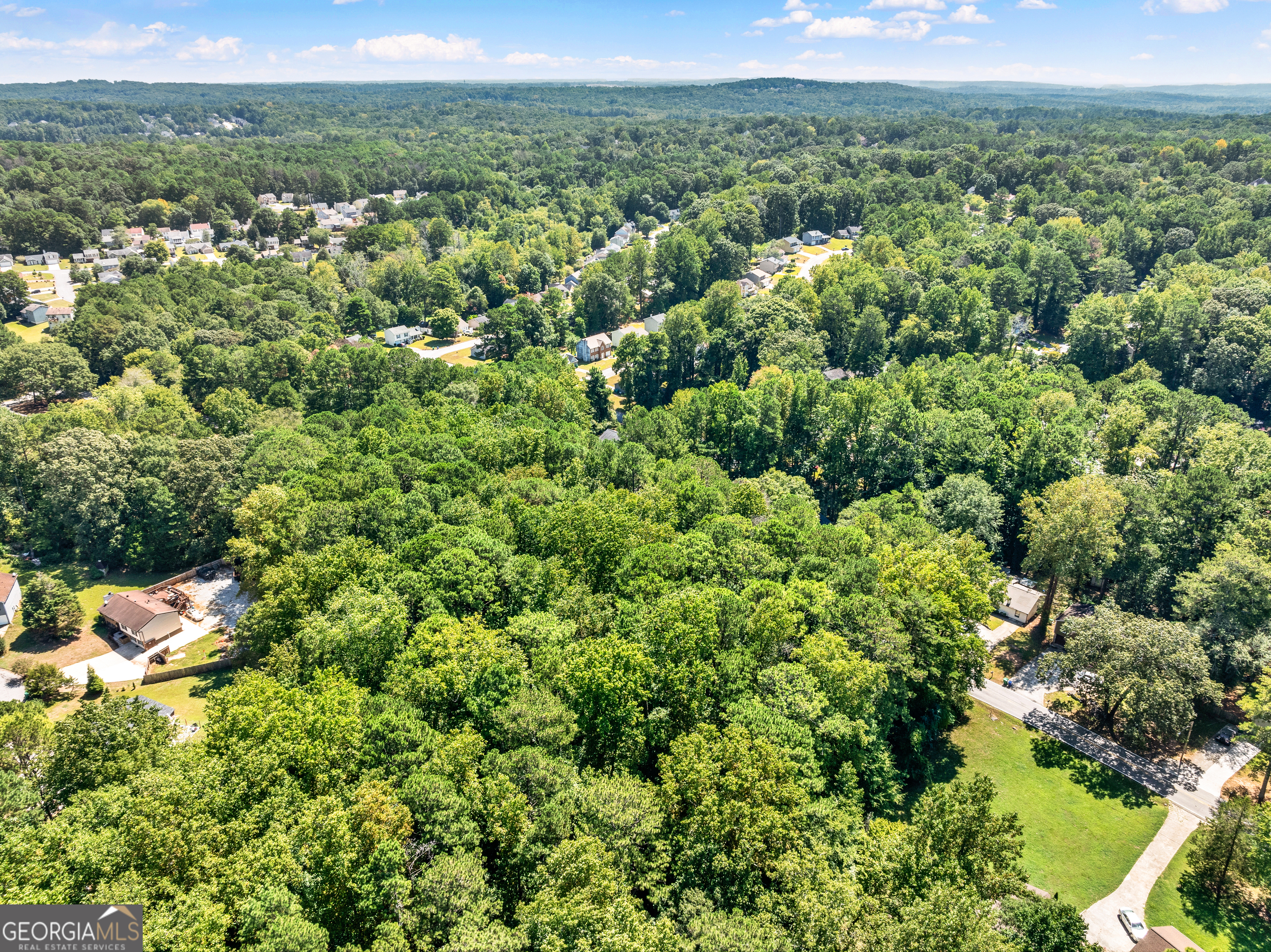 5600 Rock Springs Road Lithonia, GA 30038 - Photo 14 of 25 an aerial view of a houses with a yard