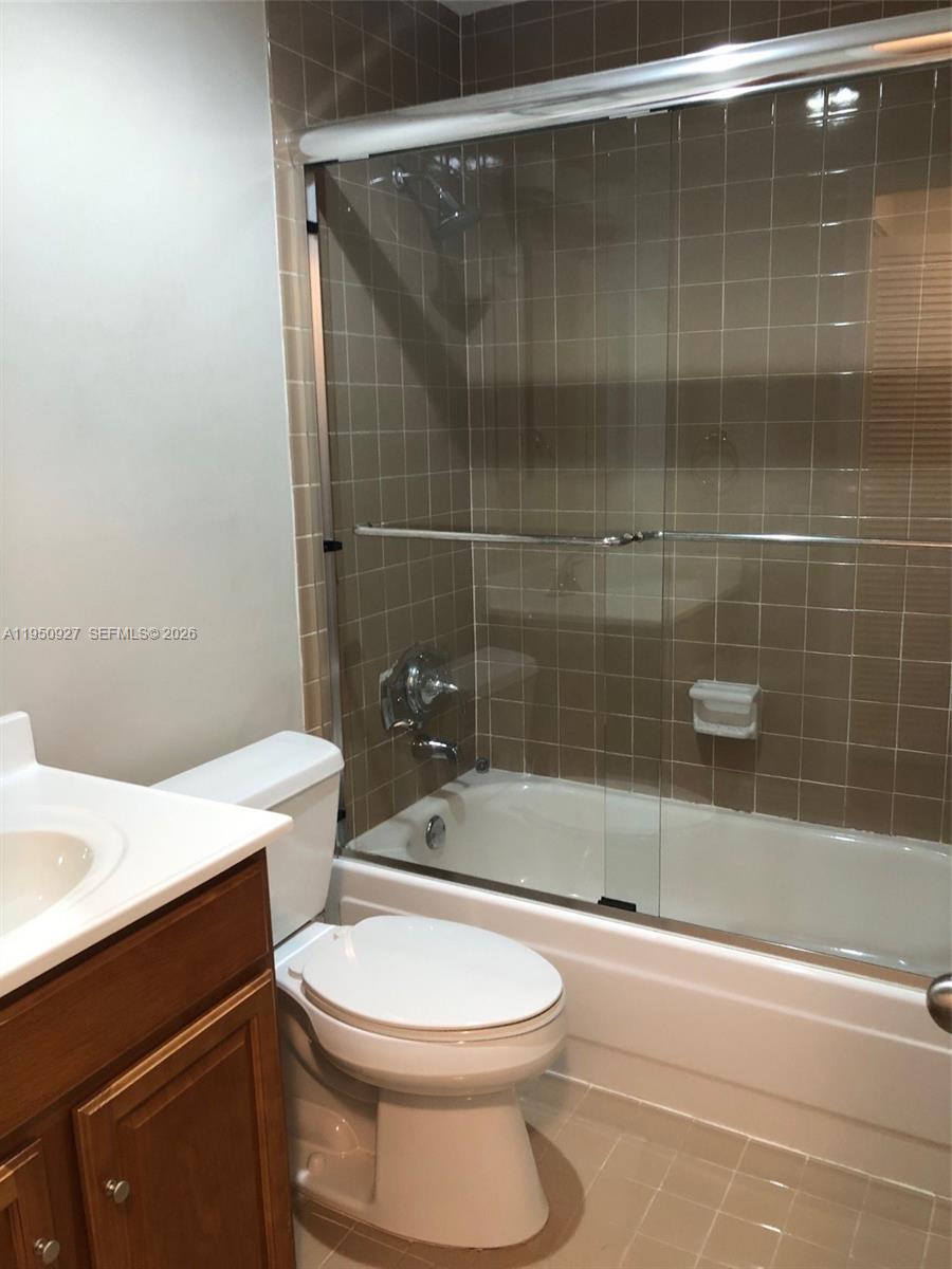 4708 Southwest 67th Avenue, Unit L23 Miami, FL 33155 - Photo 15 of 19 a bathroom with a sink a toilet and shower