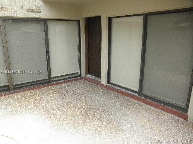 4708 Southwest 67th Avenue, Unit L23 Miami, FL 33155 - Photo 18 of 19 a view of an empty room
