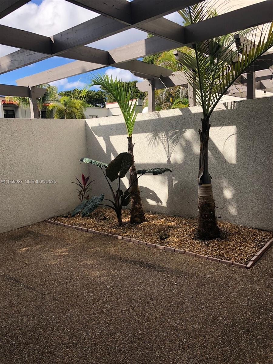 4708 Southwest 67th Avenue, Unit L23 Miami, FL 33155 - Photo 19 of 19 a view of a backyard of a house