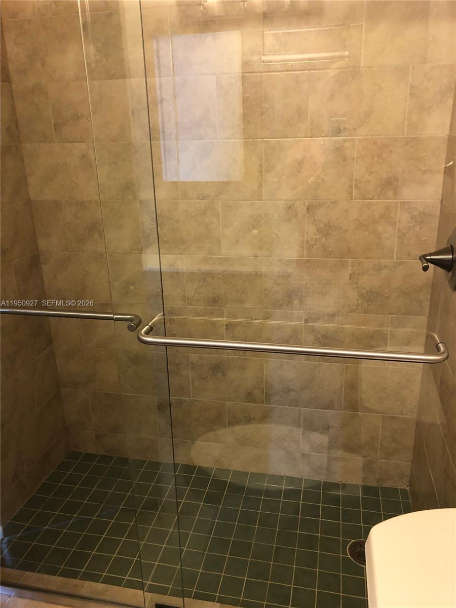 4708 Southwest 67th Avenue, Unit L23 Miami, FL 33155 - Photo 10 of 19 a bathroom with a shower