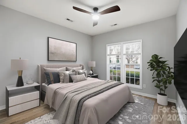 a bedroom with bed and a window