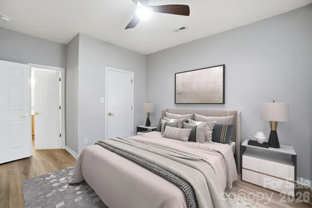 a bedroom with bed and a window