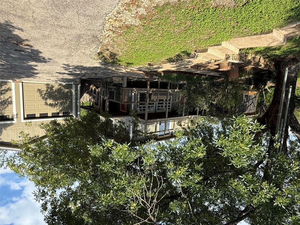 2307 B Riverside Farms Road Austin, TX 78741 - Photo 32 of 34 View of front of house featuring asphalt driveway and a garage
