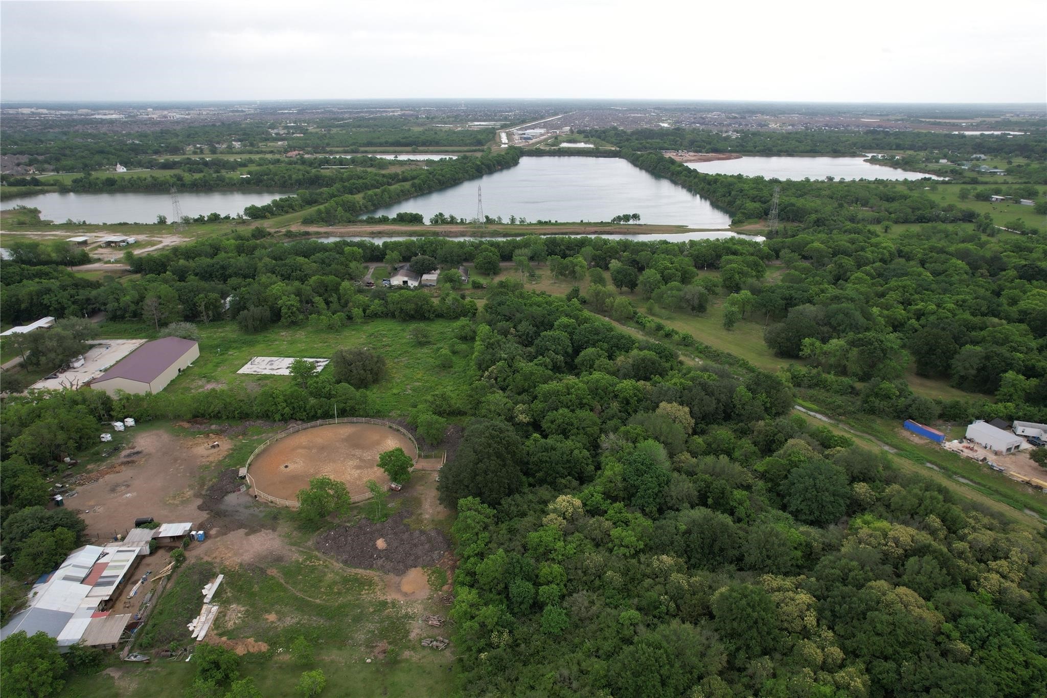 0 East Jasmine Street Fresno, TX 77545 - Photo 5 of 14 an aerial view of a house with a garden and lake view