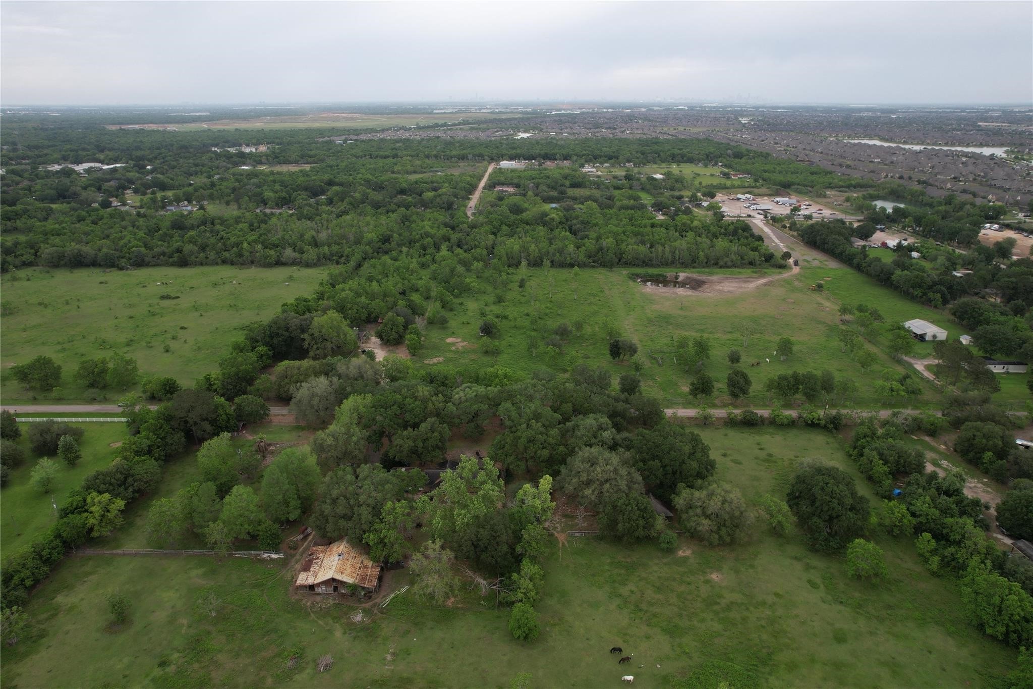 0 East Jasmine Street Fresno, TX 77545 - Photo 6 of 14 an aerial view of residential houses with outdoor space and trees