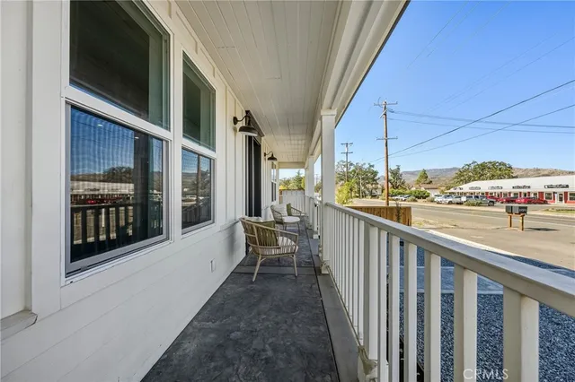 a view of balcony with furniture